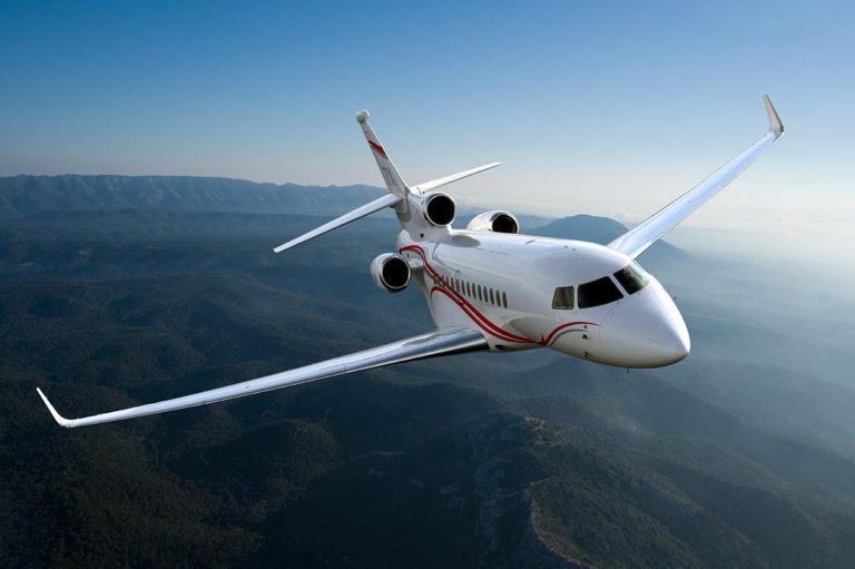 Dassault Falcon 7X from Bloom Business Jets in flight through sky.